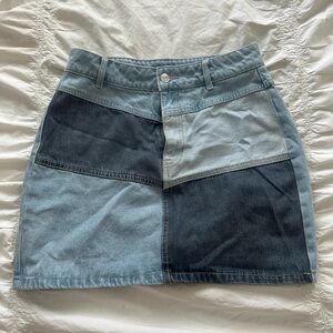 Patchwork denim skirt. Trendy mini skirt with patchwork detail